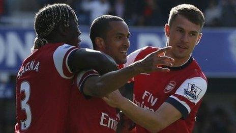 Arsenal celebrate Theo Walcott's early strike