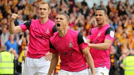 Bradford City's Nahki Wells (centre) celebrates scoring his side's decisive third goal at Burton