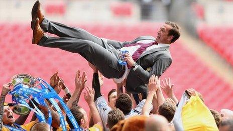 Newport County manager Justin Edinburgh is hoisted aloft by his players after winning the Blue Square Bet Premier Conference Play-off Final against Wrexham