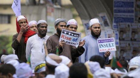 Hefazat-e Islam protestors show signs during a demonstration