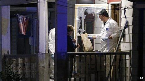 FBI members remove items from a house in Cleveland, Onio, on 6 May 2013