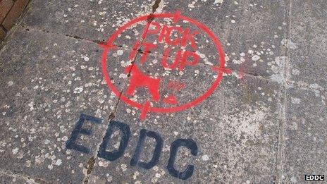 Spray-painted message on pavement