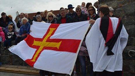 Grosse Rocque ceremony involving a Guernsey flag at Cobo in 2012