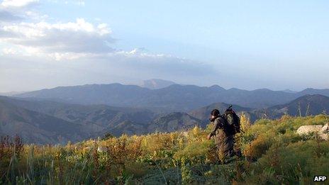 A PKK fighter is seen in an undisclosed mountainous region in Turkey near the border with Iraq, in this handout photo dated 9 May 2013