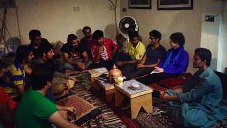 Lyse Doucet listens as young men gather to discuss Pakistan's elections in Café Bol in Lahore