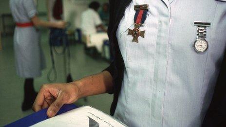 Close up of a nurse holding a chart