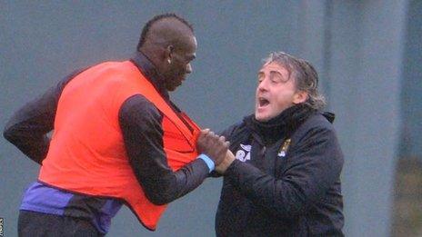 Mario Balotelli (left) and Roberto Mancini