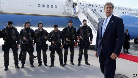 John Kerry prepares to board a plane in Stockholm