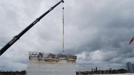 Periscopes being lifted onto HMS Alliance