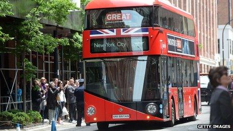 A double-decker bus carrying Prince Harry and Prime Minister David Cameron arrives at Milk Studios in New York