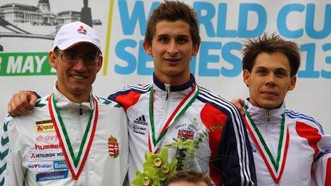 Jamie Cooke (centre) receives his World Cup gold medal