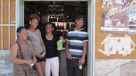 Street scene with people outside a bar