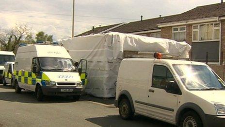 Police at a house in Ellesmere Port