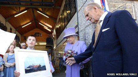 Royal couple given picture of lifeboat. Pic: Nigel Millard/RNLI