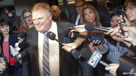 Rob Ford surrounded by reporters in Toronto. 17 May 2013