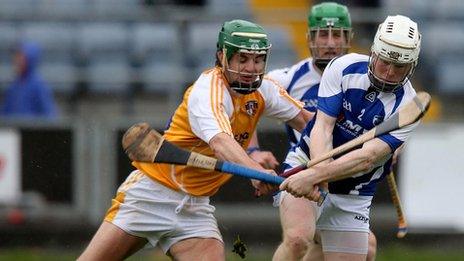 Laois' Brian Stapleton and Shane McNaughton of Antrim