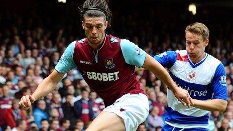 West Ham United's Andy Carroll, left, controls the ball ahead of Reading's Chris Gunter