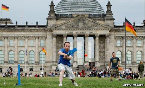 British tourist Phil Lightbody plays cricket with friends in front of the Reichstag in 2010