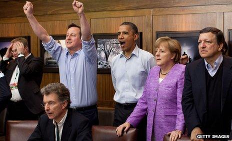 At a gathering of G8 leaders, including German Chancellor Angela Merkel, UK prime minister David Cameron celebrates as Chelsea score against Bayern Munich during the 2012 Champions League final