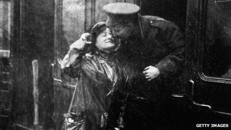 A soldier saying goodbye to a loved one at Victoria station, London, as he leaves for the front