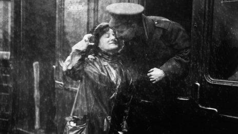 A soldier saying goodbye to a loved one at Victoria station, London, as he leaves for the front