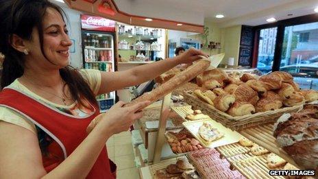 Serving customers with a smile in a French bakery