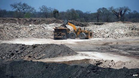 Bulldozer loads lorry in the Brazilian mining giant Vale's coalmine on the outskirts of Tete province, Mozambique, 8 November 2010