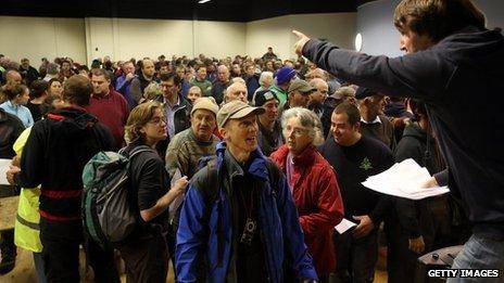 Volunteers receive instructions at the Bro Ddyfi Leisure Centre, before resuming their search for April Jones