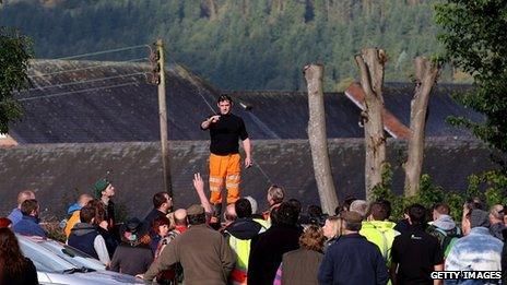 Volunteers receive instructions before resuming their search for April Jones