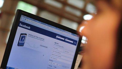 Woman using Facebook