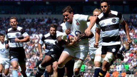 Freddie Burns is tackled for England against the Barbarians at Twickenham