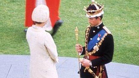 Queen Elizabeth II crowns her son Charles, Prince of Wales, during his investiture ceremony at Caernarfon Castle