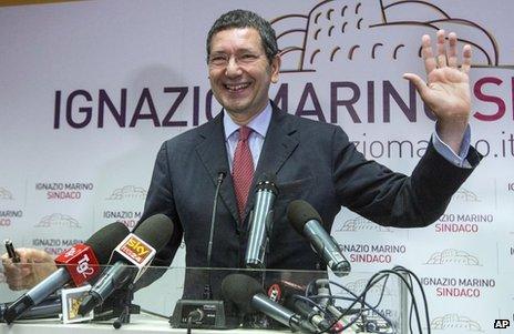 Centre-left candidate Ignazio Marino waves at a meeting in Rome, 27 May