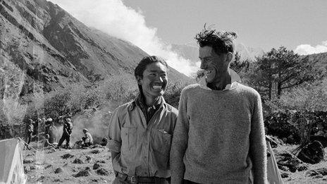 Edmund Hillary and Tenzing Norgay smile at each other on the descent after climbing Mount Everest