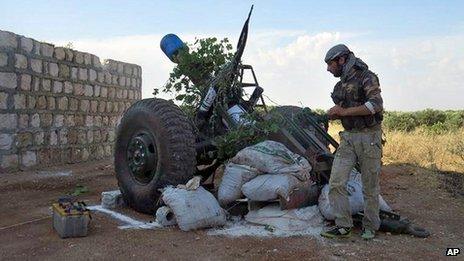 Syrian rebel firing shells made from gas cylinders in Idlib province