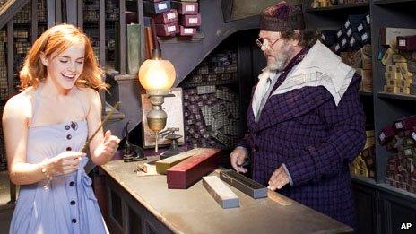 Emma Watson, who played Hermione Granger in the Harry Potter films, receiving a wand at "Ollivanders" shop, at The Wizarding World of Harry Potter at Universal Orlando Resort