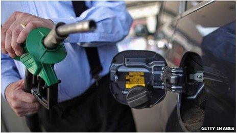 A man filling up his car with petrol