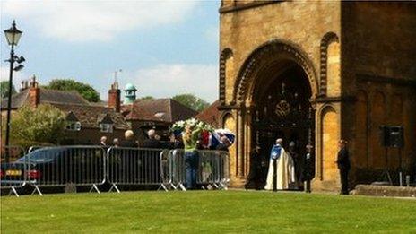 Andrew Simpson's coffin being carried into Sherborne Abbey