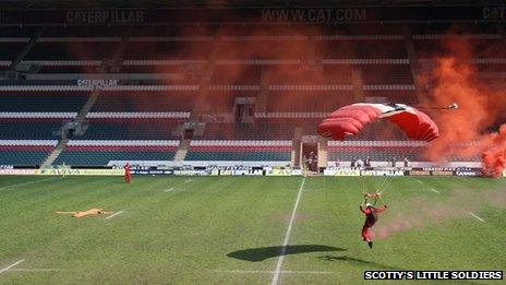 A Red Devil parachutist lands on Welford Road