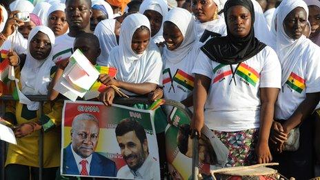 Supports of Mahmoud Ahmadinejad wait to welcome him in Accra, Ghana