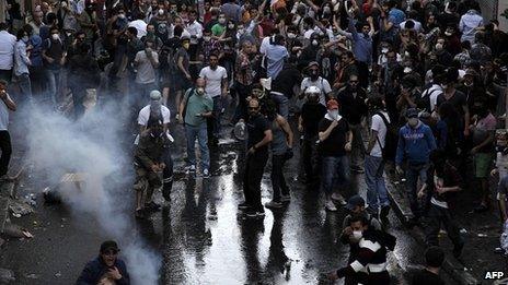 Protestors clash with Turkish riot policemen during a protest against the demolition of the Taksim Gezi Park in Istanbul