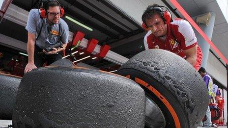 Ferrai mechanic with Pirelli tyres