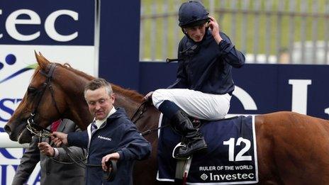 Ryan Moore acknowledges the Epsom crowd