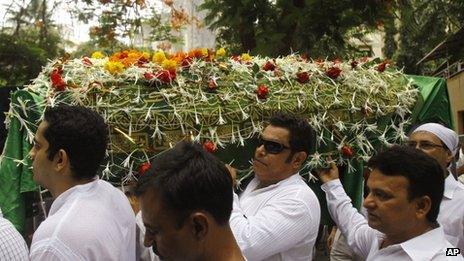 Friends and relatives carry a coffin carrying the body of Bollywood actress Jiah Khan during her funeral in Mumbai, India, Wednesday, June 5, 2013