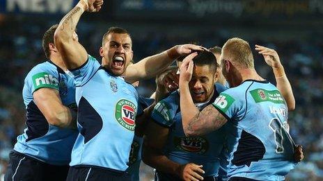 New South Wales celebrate scoring against Queensland