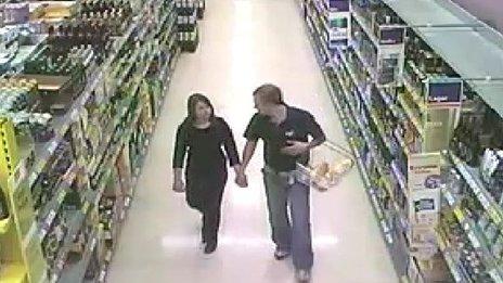 Catherine Wells-Burr and Rafal Nowak in a supermarket holding hands