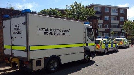 Bomb disposal van and police cars