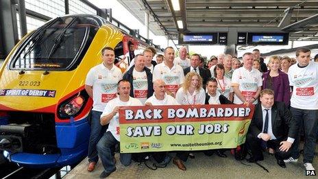 Workers protesting on a station platform