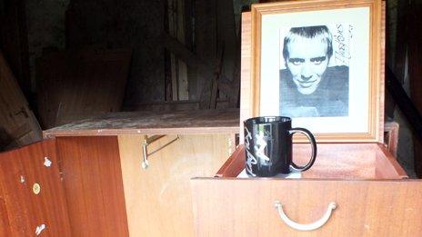 Autographed photograph of Rhys Ifans on the wardrobe he donated to his former school