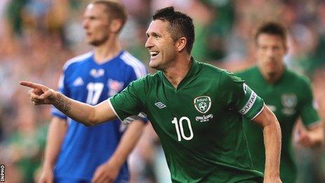 Robbie Keane celebrates his third goal